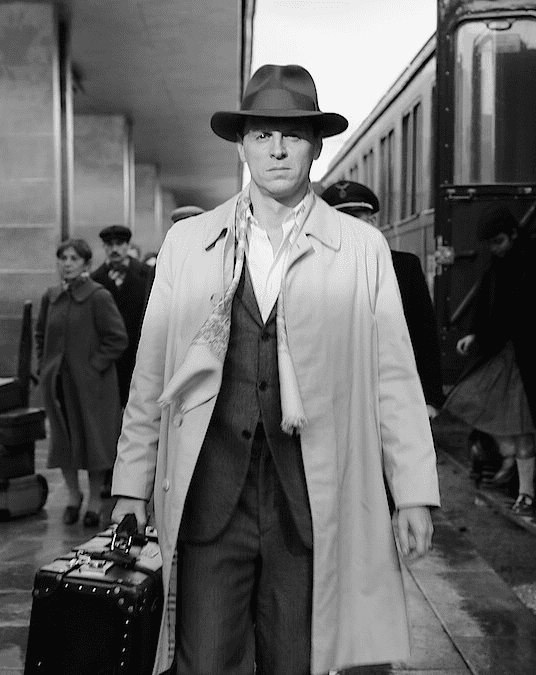 Tom Ripley with suitcase